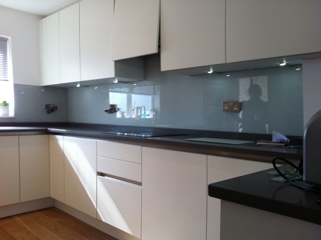 Grey glass kitchen splashback with LED lighting in Thamesmead