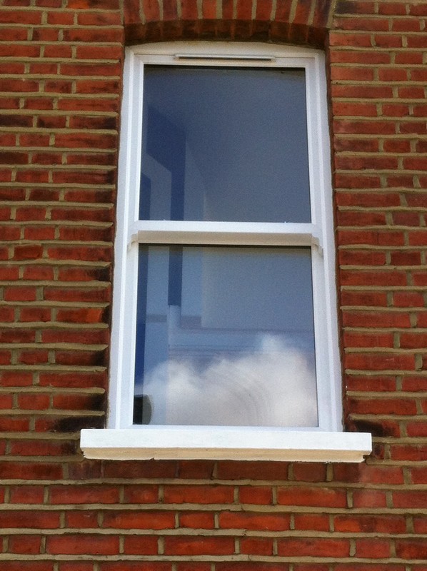 uPVC sash window on Victorian red brick house in Thamesmead